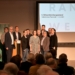 V.l.n.r.: Architekt Wolfgang Schmieder, Vorstandsdirektor der Raiffeisenbank Richard Erne, Projektentwickler Günther Ammann, Landschaftsarchitektin Karen Flügel, Alexander Pixner (VOGEWOSI), Bgm. Katharina Wöß-Krall, Architekt Dietmar Walser, Bosse Danielsen und Irmgard Huber (beide Mohrenbrauerei), Architekt Rene Bechter (Baumschlager Hutter Architekten) und Marcella Zauner (Marktgemeinde Rankweil). Foto: Gemeinde/Zimmermann