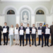 Hilmar Hoch, Vorsitzender der Prüfungskommission, Lucas Ospelt, Celina Dobler, Nora Zenhäusern, Matthias Wetzel, Furkan Öztürk, Lukas Pachschwöll, Tobias Adlberger, Fabian Wallentin, Justizminister Emanuel Schädler. Foto: IKR/Tatjana Schnalzger